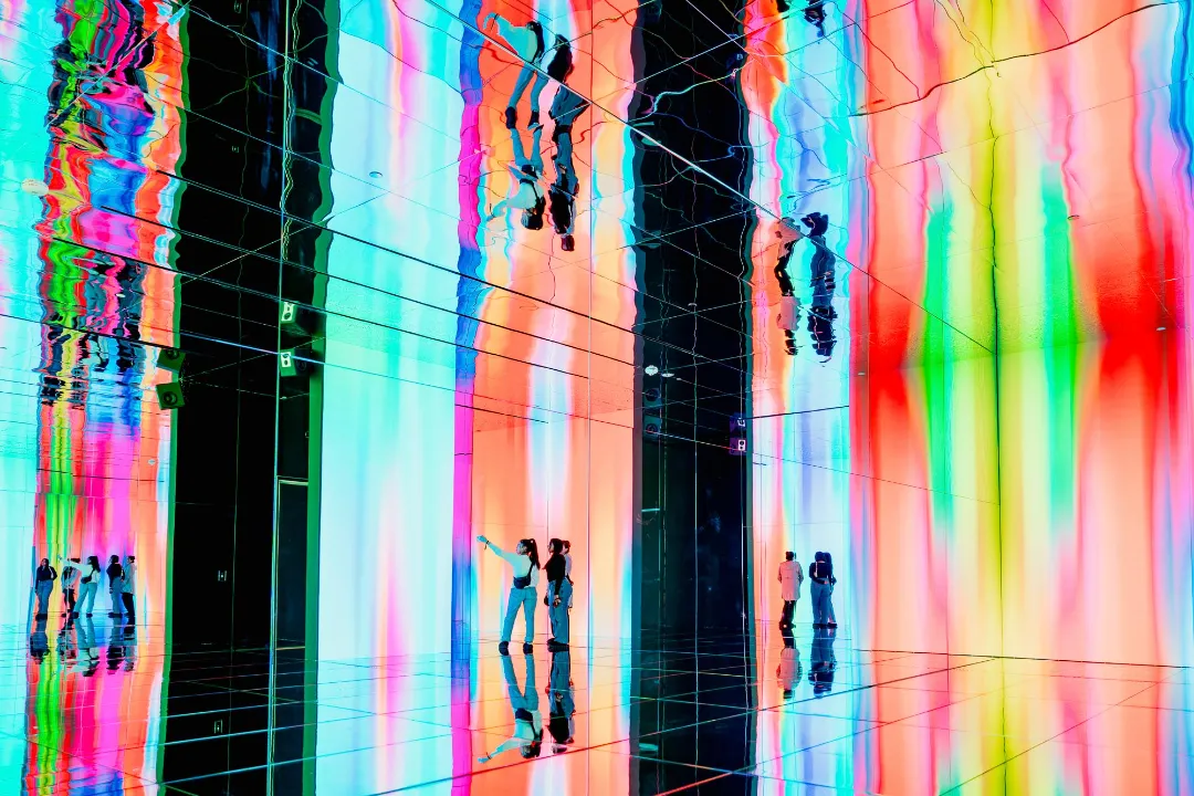 Infinity Room at Art Club, POST Houston — mirrored walls reflecting a floor-to-ceiling LED wall
