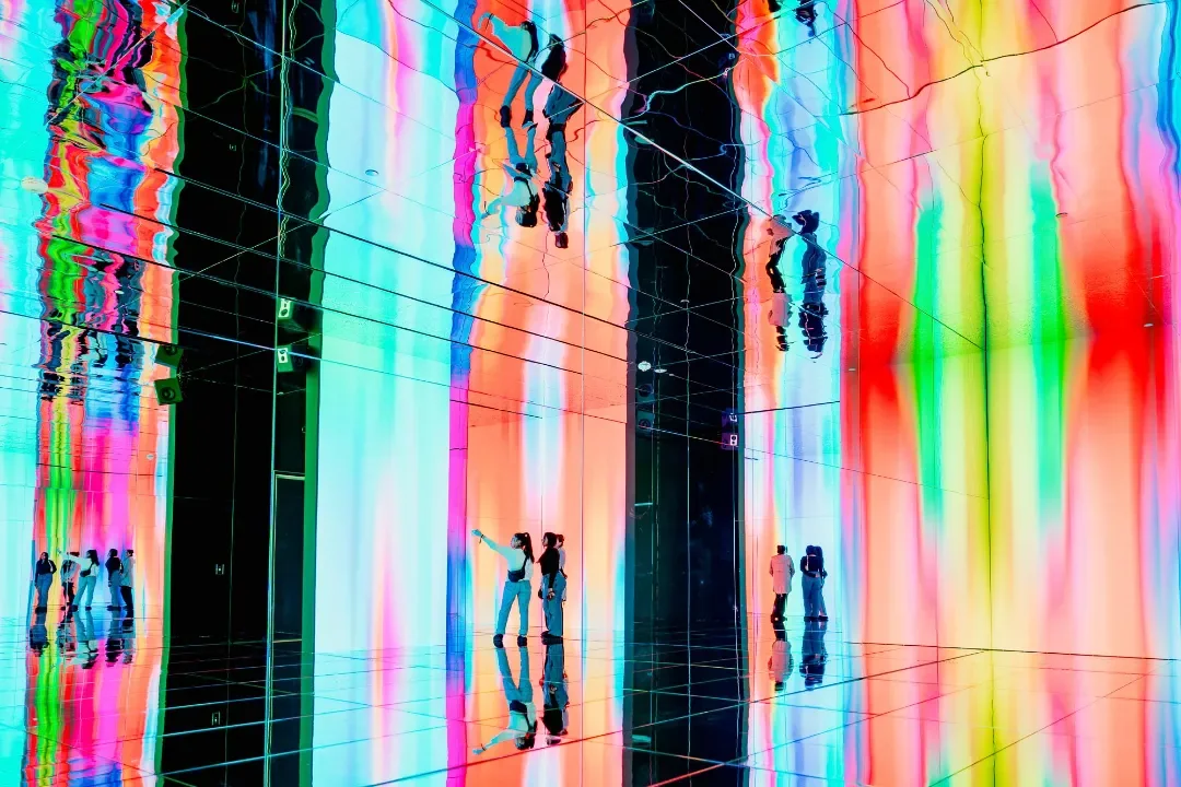 Infinity Room at Art Club, POST Houston — mirrored walls reflecting a floor-to-ceiling LED wall